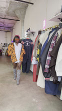 Load and play video in Gallery viewer, Orange Camo Coat
